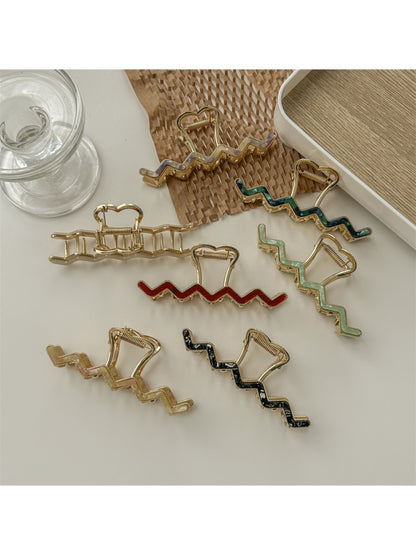 Beau wavy metal claw clip open displaying inner clasp mechanism