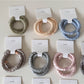 Gifty satin hair tie displayed flat showing smooth texture and soft sheen