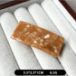 Beau curved bar hair clip displayed on a wooden surface