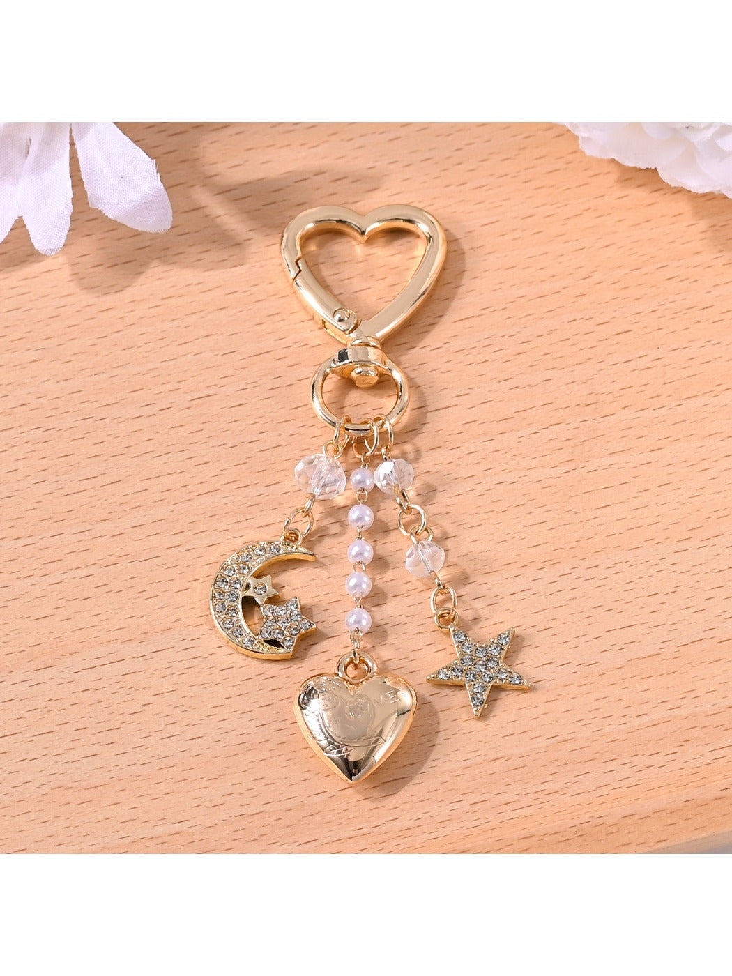 Silver alloy crescent moon charm attached to keypus keychain