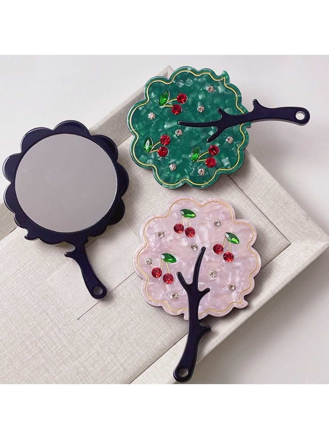 Side view of Mirroray handheld mirror highlighting the slim tree-shaped frame