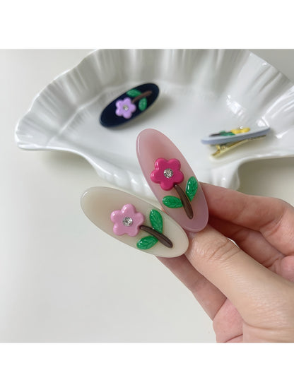 Side view of Beau oval hair clip highlighting its slim profile and glossy finish