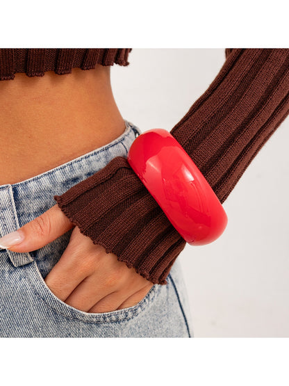 Lovra minimalist round bangle bracelet photographed with soft natural lighting
