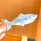 Beau shark shape claw clip angled to show overall shape and size