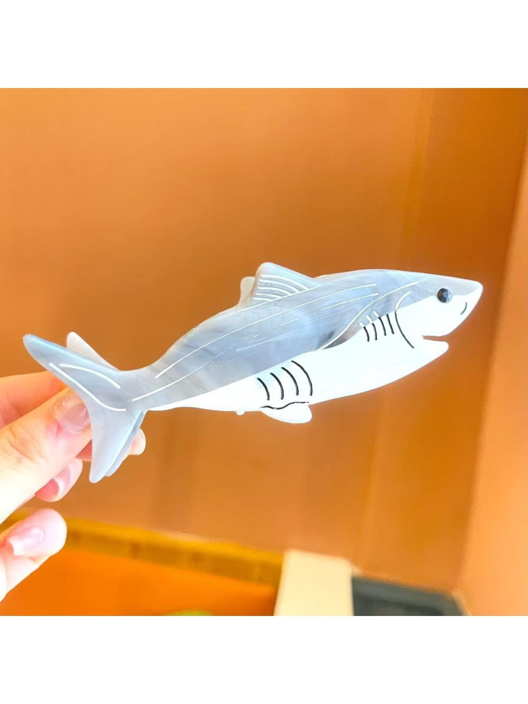 Beau shark shape claw clip angled to show overall shape and size