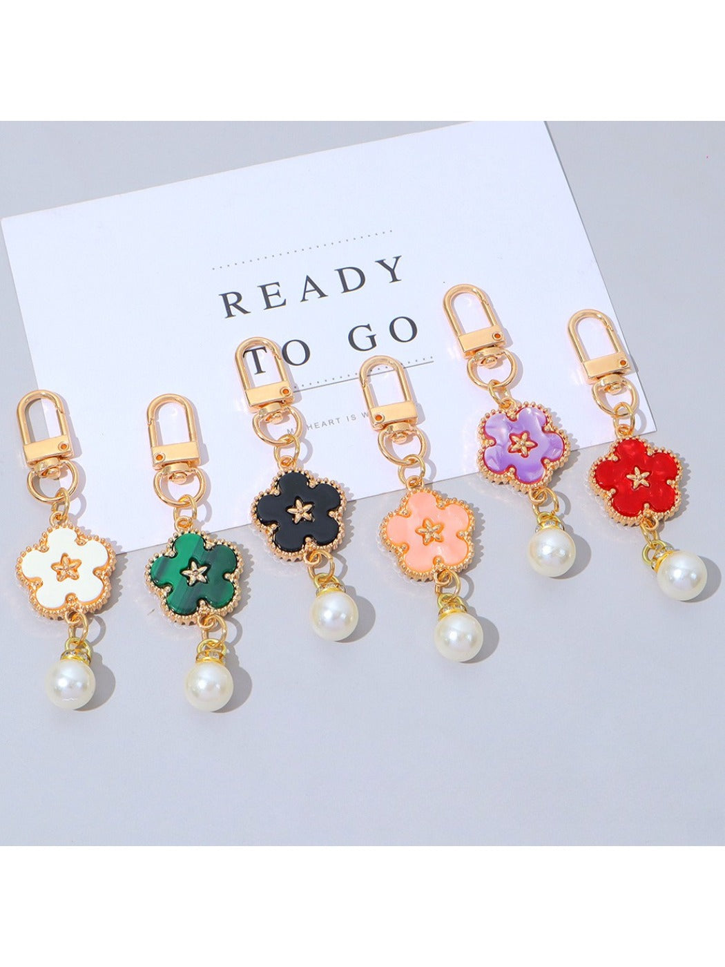 Colorful flower charm keychain with multiple vibrant petals on a silver keyring
