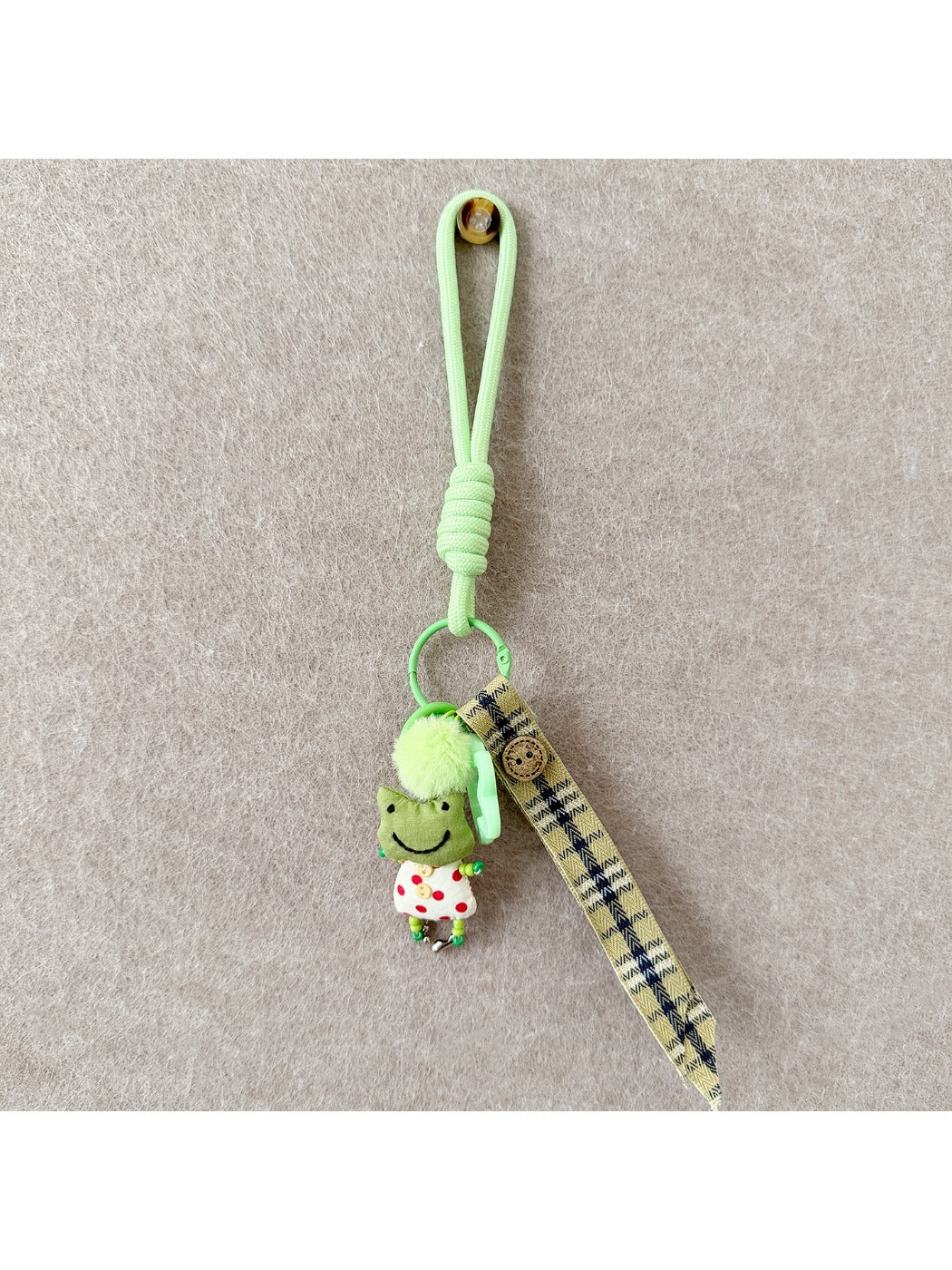 Multiple fabric animal keychains in different colors displayed together on a white background