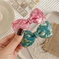 Beau - Marbled Acetate Bow Spring Hair Clip