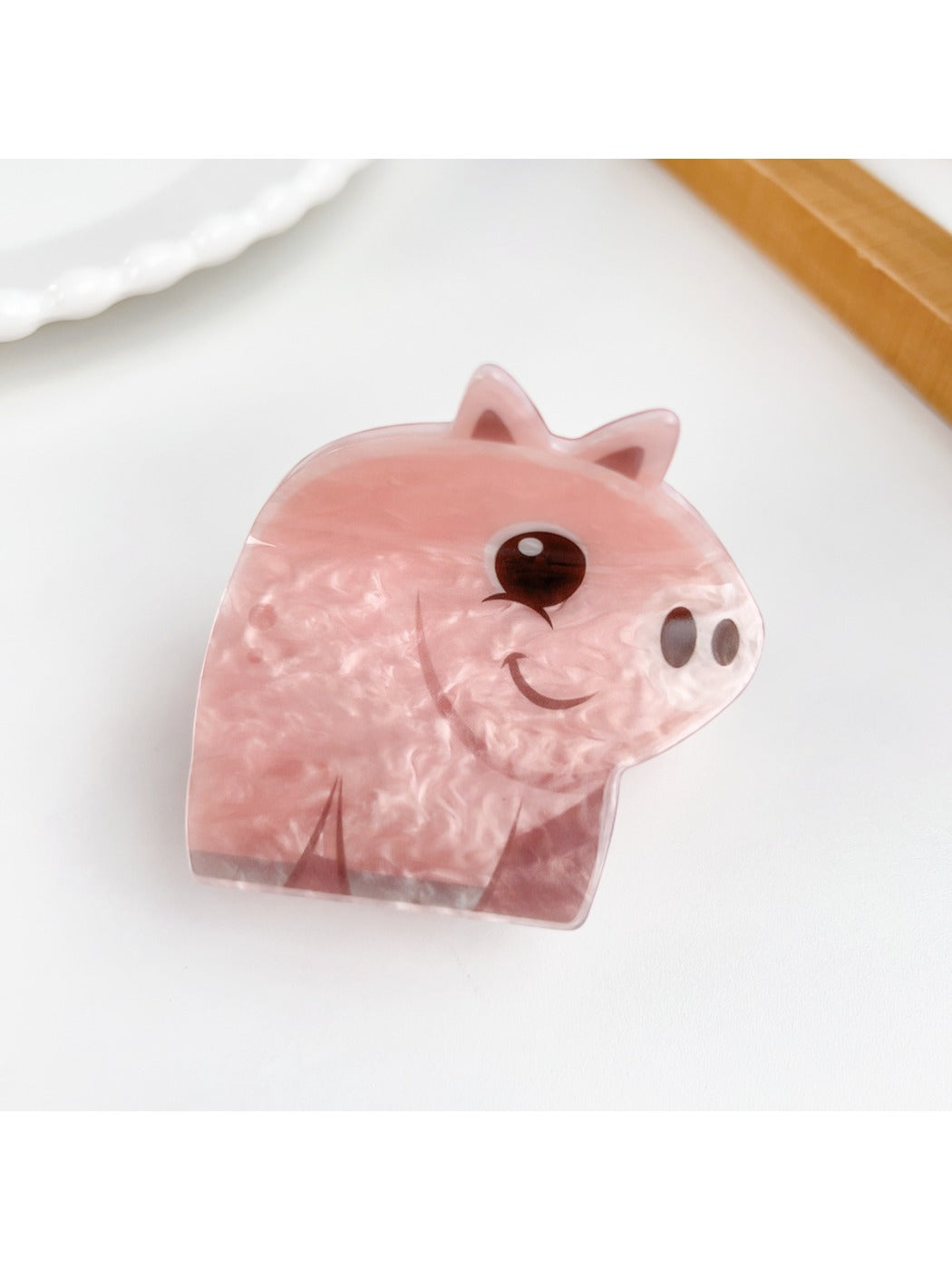 Beau bear shaped hair claw clip shown with packaging and branding