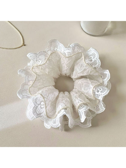Gifty scrunchie laid flat showing full circular shape and fabric ruffles