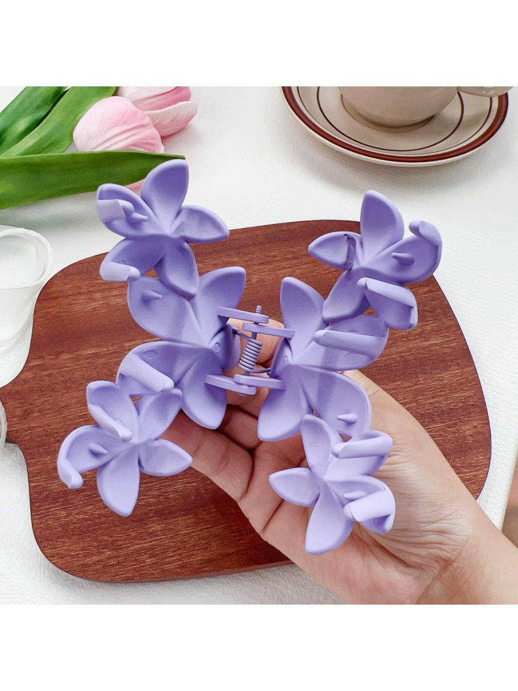 Beau Sweet Three Flower Hair Claw Clip held in hand showing size and scale