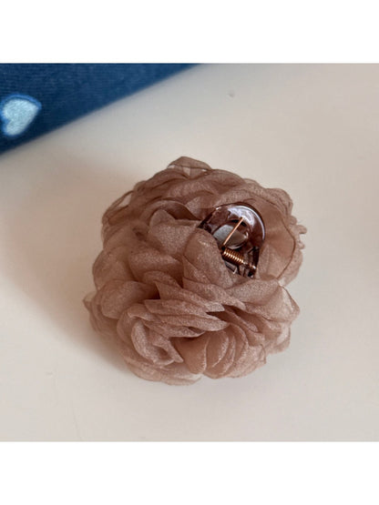 Beau rose-shaped hair clip angled to show petal layering