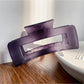 Beau square crisscross hair claw clip holding a bun hairstyle