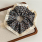 Gifty soft floral lace trim scrunchie styled with casual outfit accessories