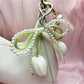 Close-up of the tulip pendant detail on the minimalist keychain