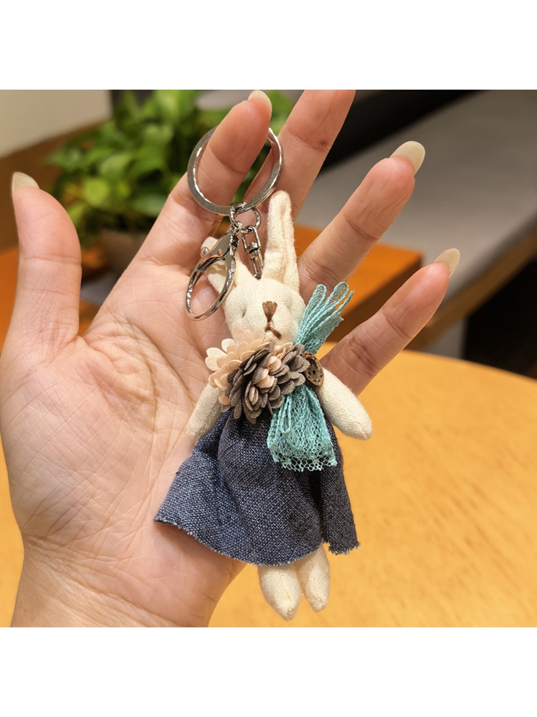 Detailed view of rabbit charm keychain ears and face from an angle