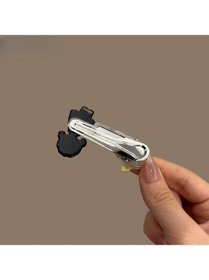 Close-up of Beau cartoon hair clip showing vibrant colors and smooth finish