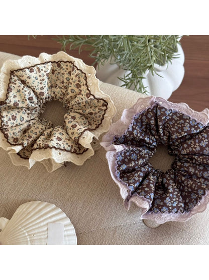 Side view of Gifty Retro Lace Floral Scrunchie highlighting lace texture and floral details