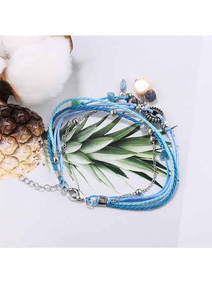 Side view of Lovra small bead alloy bracelet highlighting clasp design