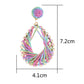 Earedge elegant hollow drop woven earrings displayed on a jewelry stand