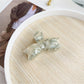 Beau hair claw clip in pastel pink on neutral background