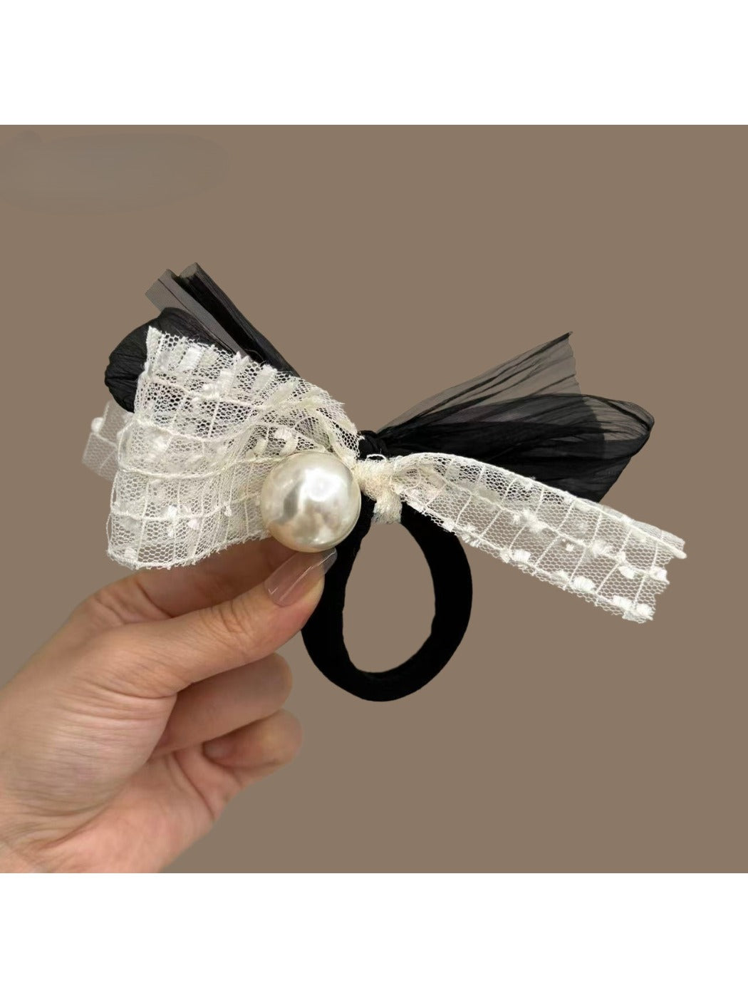 Classic black hair tie with a large satin bow embellished with small pearls