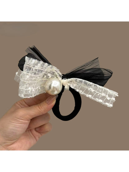 Classic black hair tie with a large satin bow embellished with small pearls