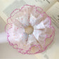 Colorful polka dot ruffle scrunchie on a white background