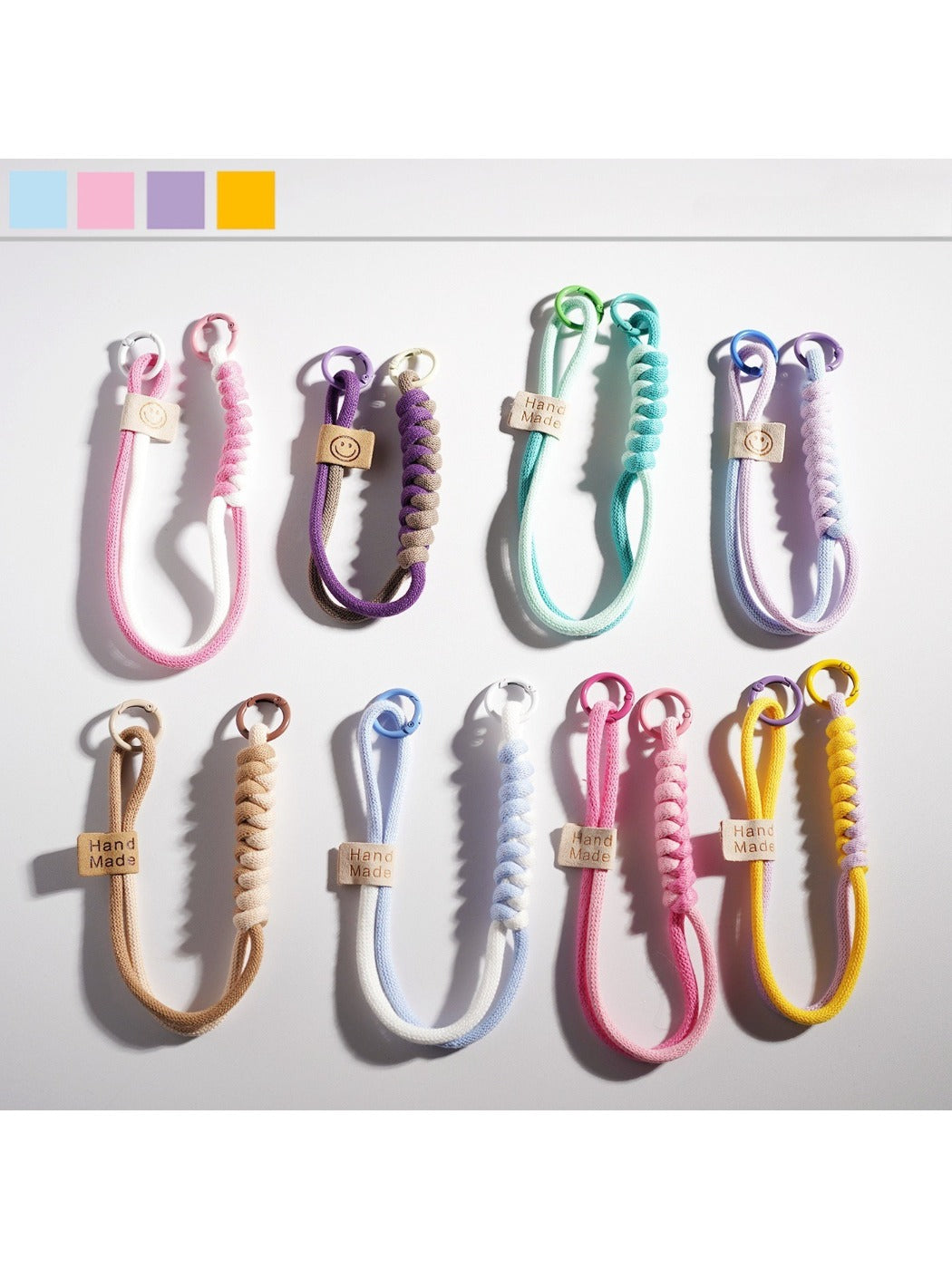 Colorful minimalist rope keychain with metal ring on white background