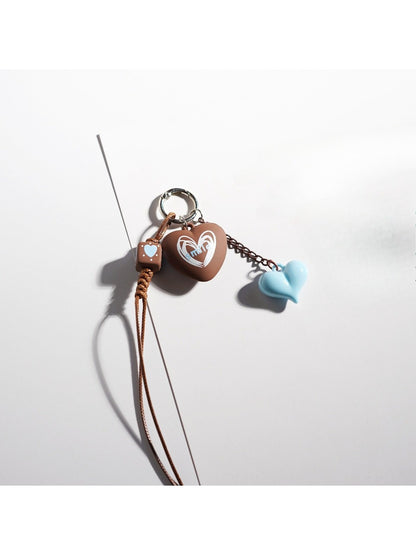 Brown cartoon keychain featuring a cute character with big eyes