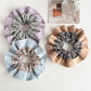 Close-up of Gifty plaid scrunchie showing fabric texture and color pattern