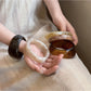 Side view of Lovra irregular shaped ombre bangle bracelet highlighting thickness