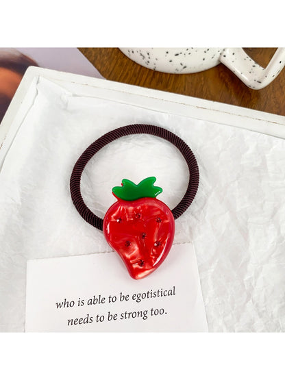 Hair ties with various fruit charms arranged in a circle