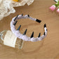 Top view of Gifty Sweet Polka Dot Headband highlighting bow shape