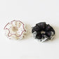 Close-up of Gifty vintage polka dot scrunchie showing ruffled texture