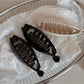 Beau minimalist stick hair clip securing a bun hairstyle on model