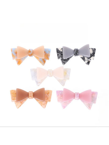 Beau hair clip worn in styled hair showcasing bow placement