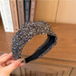 Wide vintage print headband styled with loose hair on female model