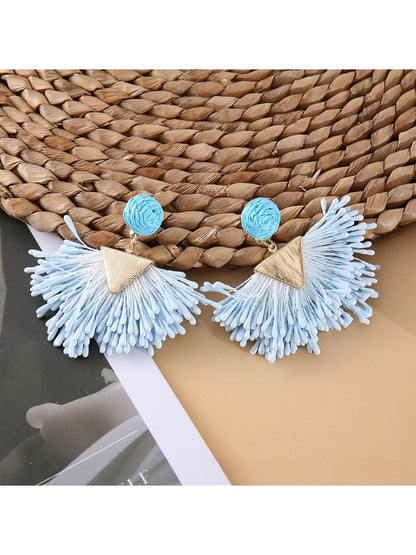 Earedge raffia earrings displayed with matching necklace on neutral background