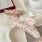Side view of Beau half moon hair claw clip highlighting clip mechanism and print