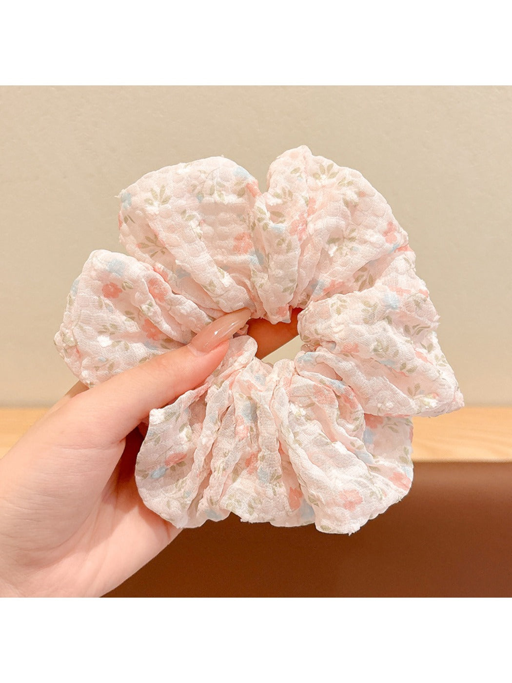 Gifty scrunchie in soft pastel colors with delicate floral design