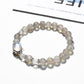 Lovra gray crystal beaded bracelet displayed on a wooden surface