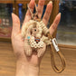 Fabric pony keychain with pastel colors and soft texture close-up