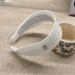 Gifty headband folded to show flexibility and fabric quality