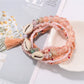Multiple Lovra beaded bracelets stacked together showcasing bohemian style