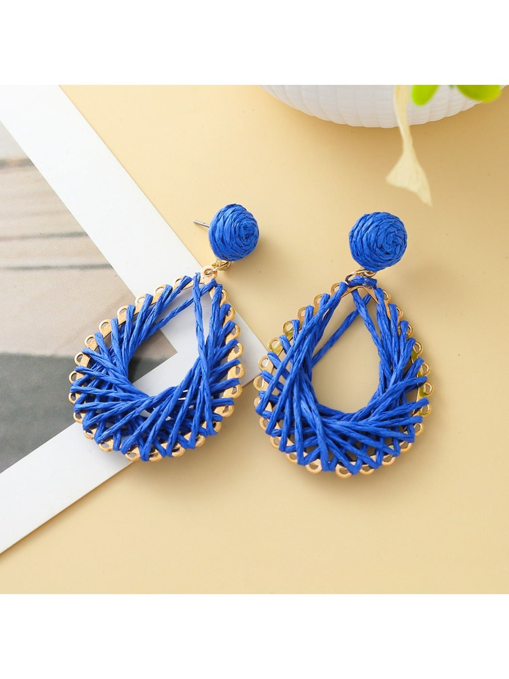 Earedge hollow drop woven earrings packaged in branded jewelry box
