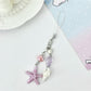 Mini starfish keychain displayed with other beach-themed accessories