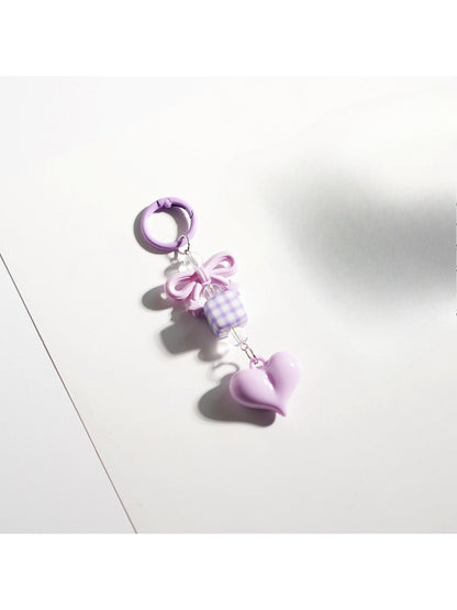 Keypus cute bow heart beaded keychain hanging from a metal hook