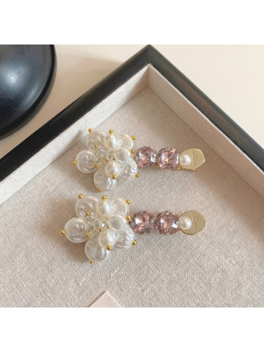 Beau Sweet Style flower hair clip attached to brown hair in a side hairstyle