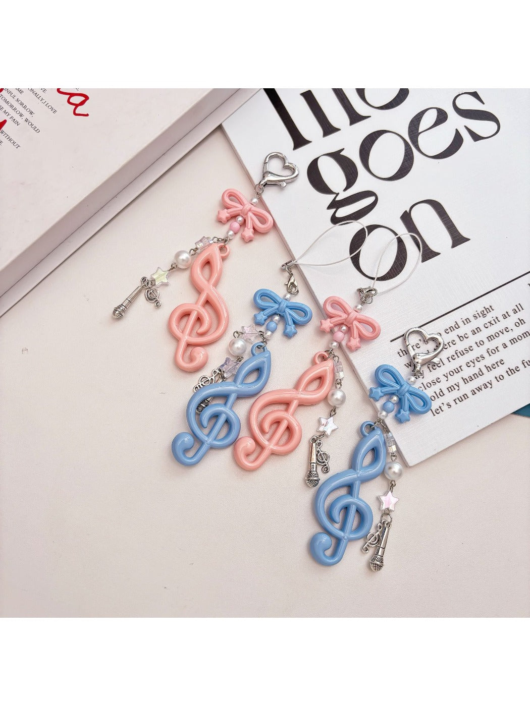 Keypus music note keychain hanging from a silver keyring